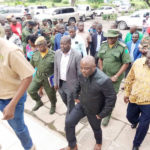 Defence Minister Davies Chama and Home Affairs Minister Stephen Kampyongo flanked by Police Inspector General Kakoma Kanganja arriving in Chingola on Sunday