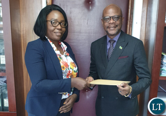 PS health Permanent Secretary of the Ministry of Health Ms. Kakulubelwa Milalelo handing the signed crucial MoU to Ambassador Mukwita in her office in Lusaka recently. Courtesy of the embassy of Zambia in Berlin.