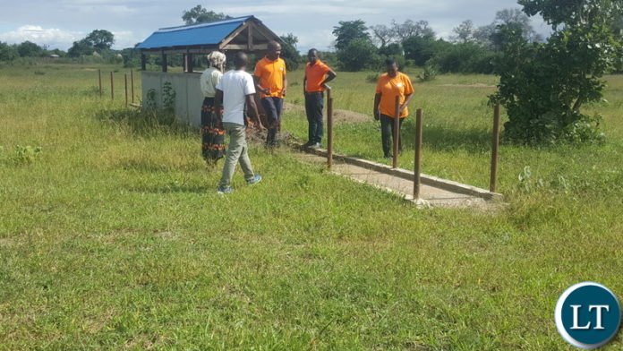 District implementation team led by Monze Town Council Socioeconomic Planner Jack Deka (centre) inspecting a goat deep tank at Munyenze District implementation team led by Monze Town Council Socioeconomic Planner Jack Deka (centre) inspecting a goat deep tank at Munyenze