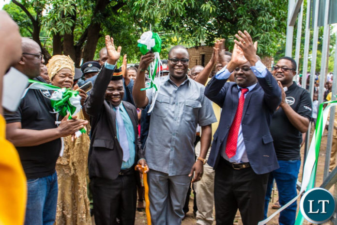 Eastern Province Minister Makebi Zulu (centre) cuts the ribbon to officially commission the Chiwawatala site as Zamtel CEO Sydney Mupeta cheers on