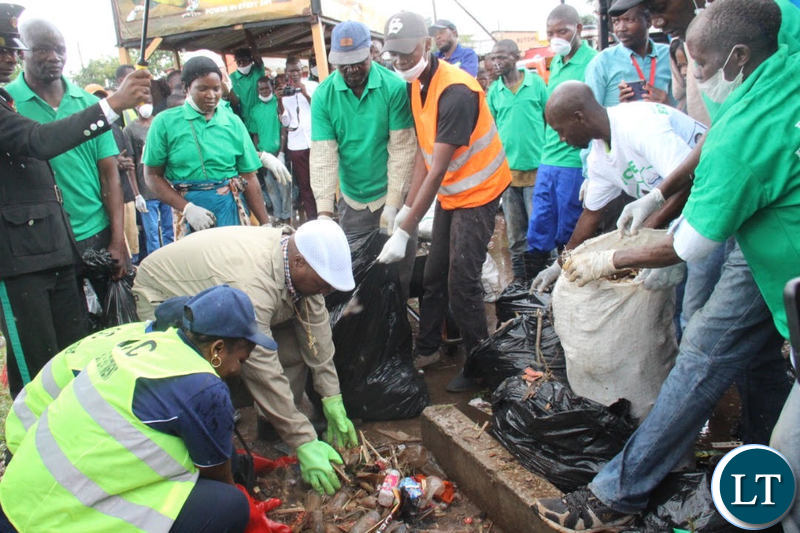 Mayor Sampa with Councillor Chitangala leading the cleaning exercise