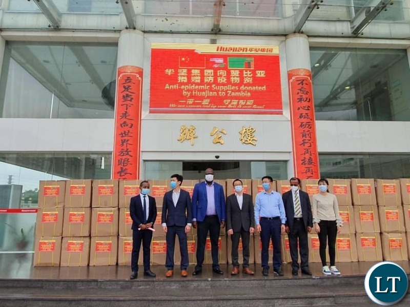 Consul General at the Consulate of the Republic of Zambia in Guangzhou His Excellency Mr. Daniel Chisenga Receiving  the Donations