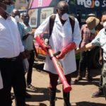 Minister of Local Government Charles Banda  leading a team who conducted a sanitising exercise for flash mini buses and the entire millennium bus station