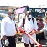Minister of Local Government Charles Banda  leading a team who conducted a sanitising exercise for flash mini buses and the entire millennium bus station