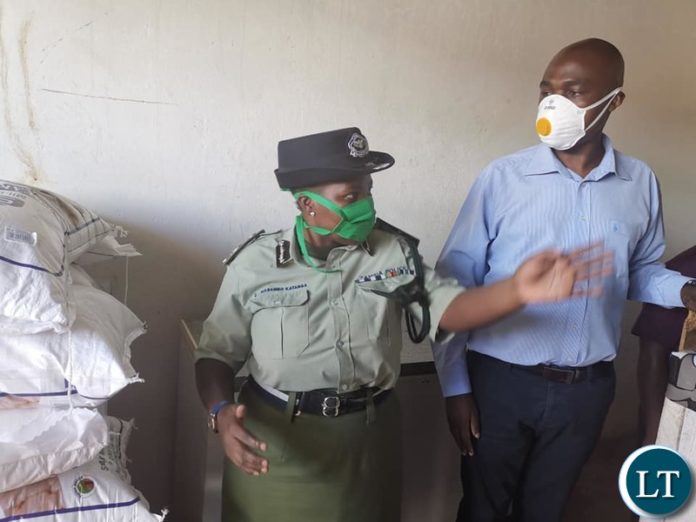 Copperbelt Minister Mr Mwakalombe flanked by Copperbelt Police Commsioner Charity Katanga, NCC Town clerk Wisdom Bwalya , District Commsioner Anthony Katongo and other officials Copperbelt Minister Mr Mwakalombe flanked by Copperbelt Police Commsioner Charity Katanga, NCC Town clerk Wisdom Bwalya , District Commsioner Anthony Katongo and other officials
