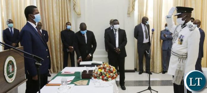 President Lungu at State House during the swearing in ceremony of Richard Mwanza as High Commissioner to Ghana, Joyce Kasosa as High Commissioner to Kenya, Pandwe Lubamba as Chief Policy Analysist for Project Implementation at State House and Chilije Nyirenda as Police Commissioner for Luapula Province.