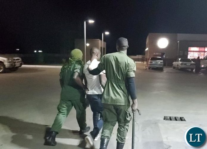 Police pick up a man found consuming alcohol