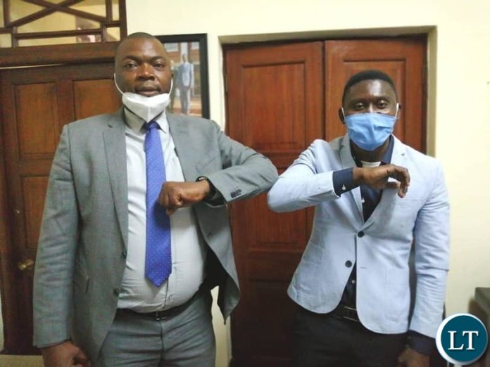 Brian Bwembya popularly known as B-Flow with Lusaka Province Minister Bowman Lusambo