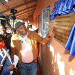 Lusaka Province Minister Bowman Lusambo unveils a plaque after handing over the refurbished dormitory at Solwezi Technical School which is now named after him