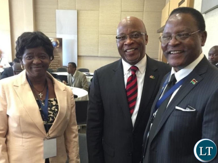 Dr Nevers Mumba sharing a light moment with Malawi President Elect Lazarous Chakwera with his wife