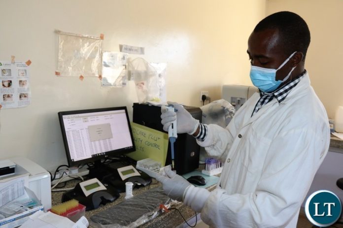 Lab technician analysing blood samples for lead poisoning