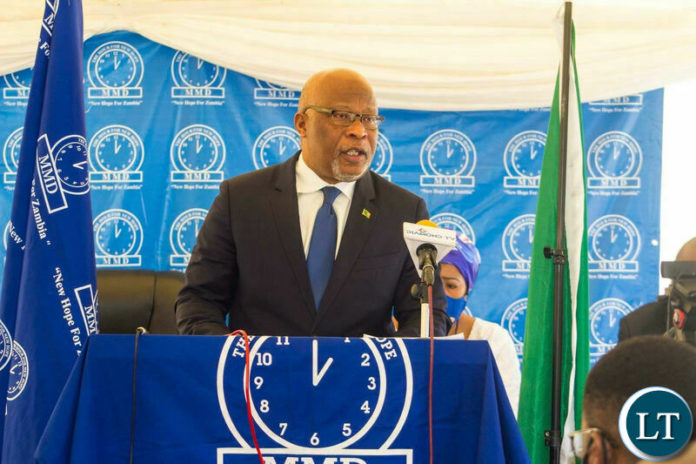 New Hope MMD President Dr. Nevers Mumba prays for Zambia during the 30 years of the MMD.