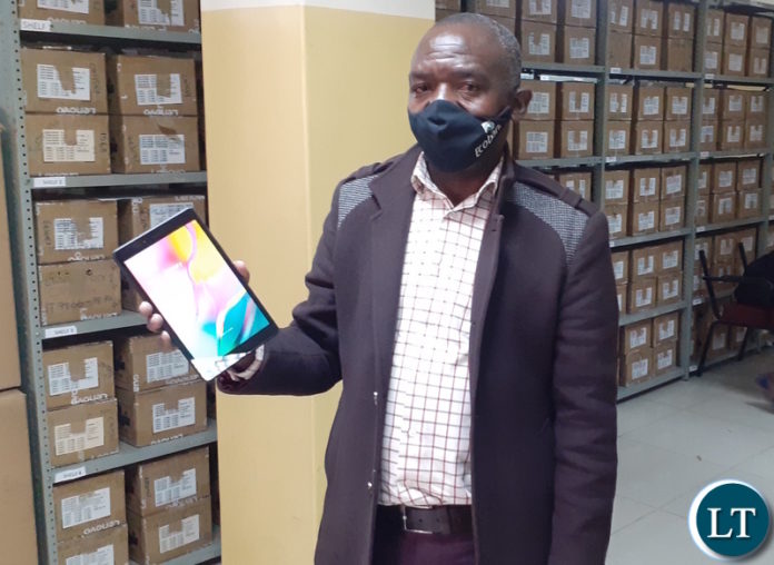 Zambia Statistics Agency (ZamStats) IT assistant programmer Constain Munsaka displays one of the tablets that the Government of Zambia has purchased for use in the 2020 Census of Population and Housing. 9 July 2020. Lusaka. Photo | MNDP Zambia Statistics Agency (ZamStats) IT assistant programmer Constain Munsaka displays one of the tablets that the Government of Zambia has purchased for use in the 2020 Census of Population and Housing. 9 July 2020. Lusaka. Photo | MNDP