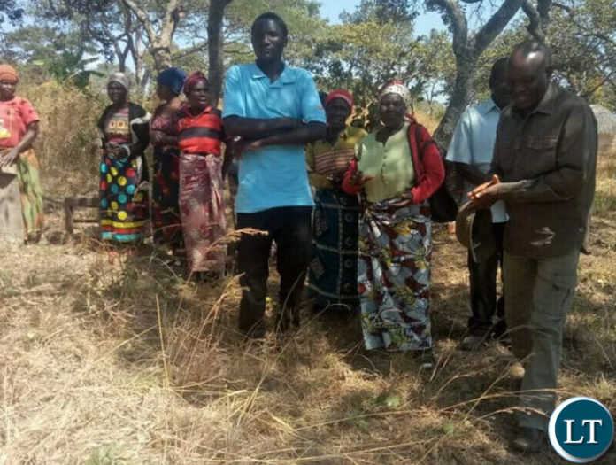 Fred M'membe (R) with Peasant Farmers