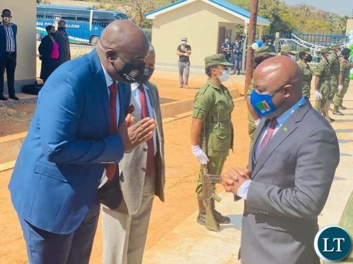 Home Affairs Minister Stephen Kampyongo (R)