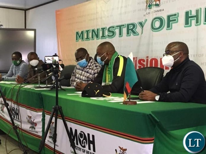 Lusaka Province minister Mr. Bowman Lusambo with Health Minister Dr Chitalu Chilufya at a news briefing