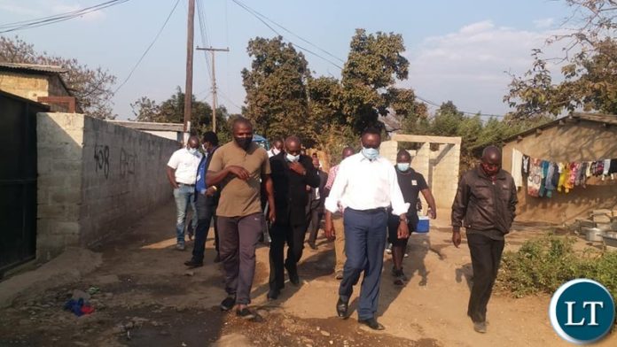 mutendere Minister of Water Development, Sanitation and Environmental Protection Dr Jonas Chanda is checking works by the Lusaka Water & Sewerage Company in Mtendere B to establish source of water contamination.