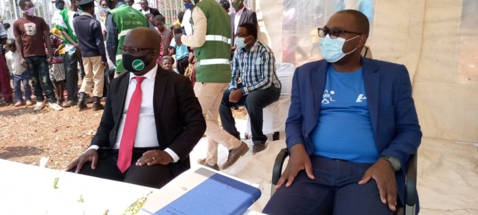 Zamtel CEO Sydney Mupeta and Transport and Communications Minister Mutotye Kafwaya follow proceedings during the launch of a tower at Mukupa Kaoma village in Lunte District.