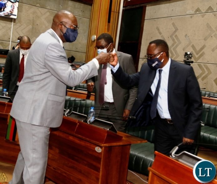 Water development Minister Dr Jonas Chanda congratulates Finance Minister, Bwalya Ng'andu for the 2021 budget presentation in parliament. Water development Minister Dr Jonas Chanda congratulates Finance Minister, Bwalya Ng'andu for the 2021 budget presentation in parliament.