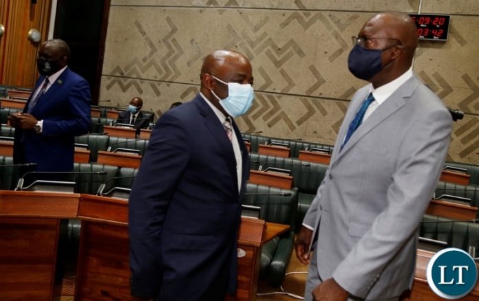 Home Affairs Minister Stephen Kampyongo talks to Finance Minister Bwalya Ng'andu during the 2021 budget presentation