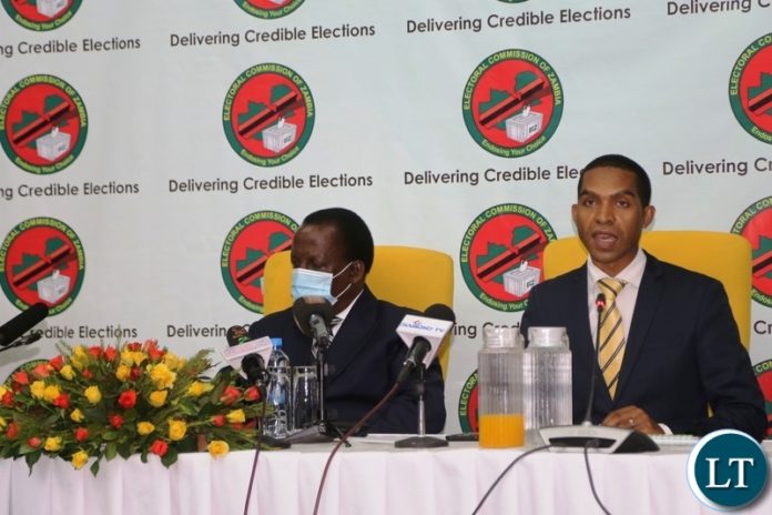 -Electoral Commission of Zambia Chief Electoral Officer Patrick Nshindano flanked by Electoral Commission of Zambia Chairperson Judge Esau Chulu speaking during the launch of online voter registration at Mulungushi International Conference center. -Electoral Commission of Zambia Chief Electoral Officer Patrick Nshindano flanked by Electoral Commission of Zambia Chairperson Judge Esau Chulu speaking during the launch of online voter registration at Mulungushi International Conference center.