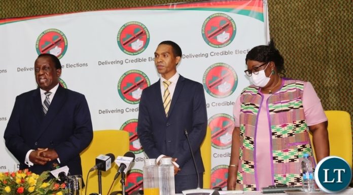 Electoral Commission of Zambia Chief Electoral Officer Patrick Nshindano with Electoral Commission of Zambia Chairperson Judge Esau Chulu and Commissioner Dr Emily Sikazwe during the launch of online voter registration at Mulungushi International Conference center.