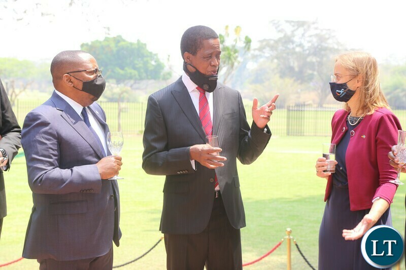 President Edgar Lungu talks to Germany ambassador to Zambia Wagner-Mitchell while Rwandan High Commissioner to Zambia Amandin Rugira listerns after they presented their letters of credence at State House