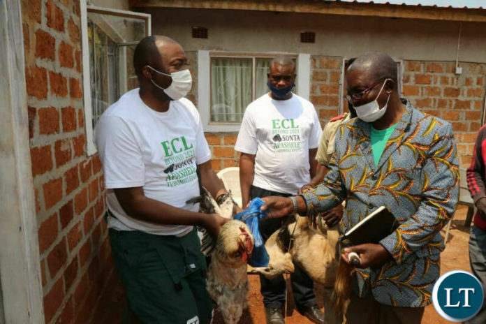 Chief Lumpuma hands over gifts to Mr Lusambo when he visited the place on Saturday