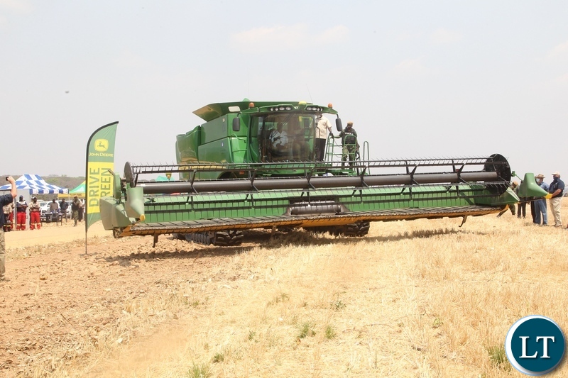 President Edgar Lungu operating the combine harvester during the launch of the national wheat harvest at chobe Agrivision farm in Mkushi district central province