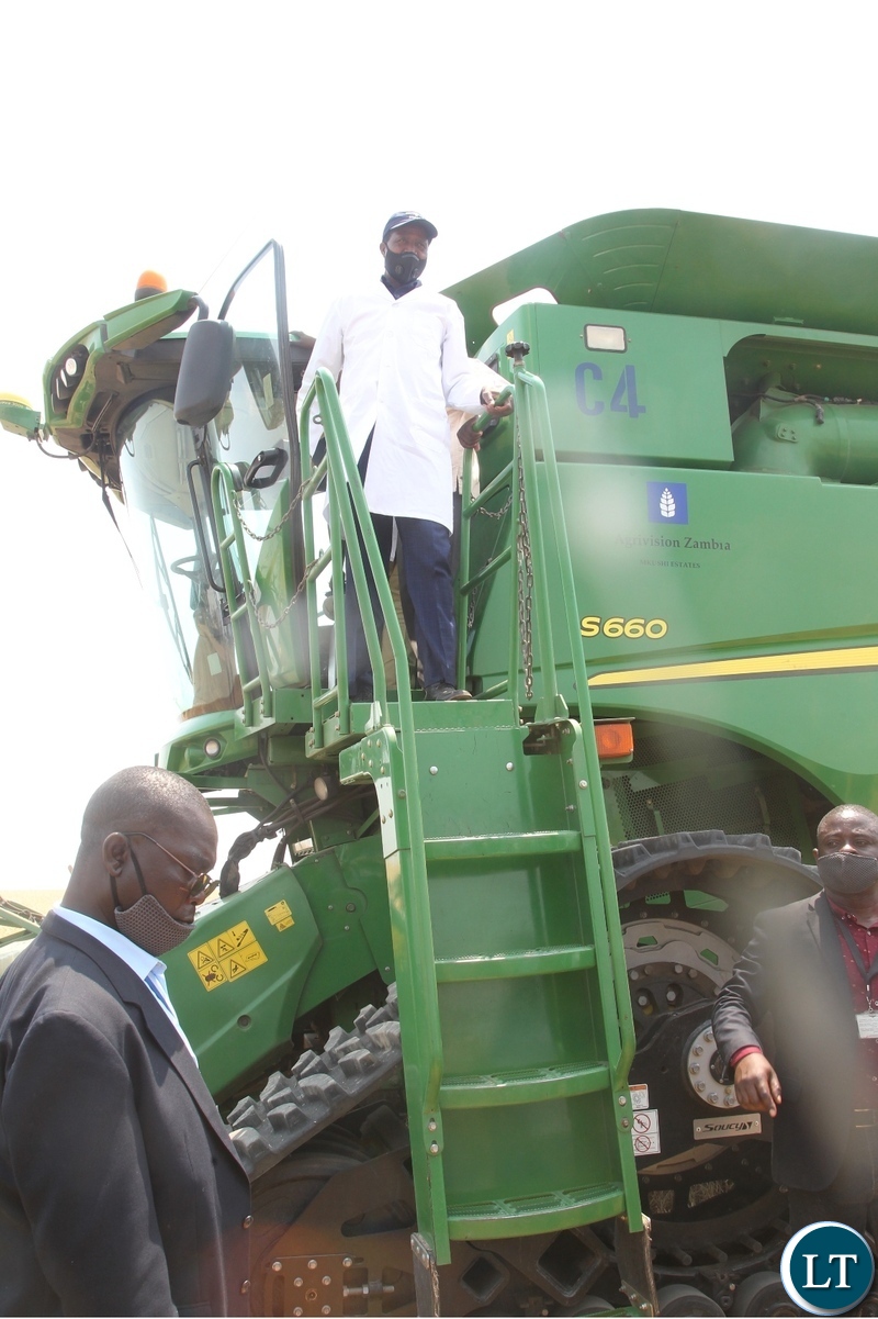 President Edgar Lungu disembarks from the combine harvester during the launch of the national wheat harvest at chobe Agrivision farm in Mkushi district central province