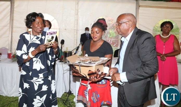 Vice President Inonge Wina showing the book called "the first female Vice President" authored by Franklin Tembo (r) during the Book Launch at the government house Vice President Inonge Wina showing the book called "the first female Vice President" authored by Franklin Tembo (r) during the Book Launch at the government house