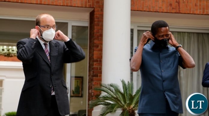 President Edgar Lungu and United Kingdom Minister for Africa James Duddridge putting on the facemasks President Edgar Lungu and United Kingdom Minister for Africa James Duddridge putting on the facemasks
