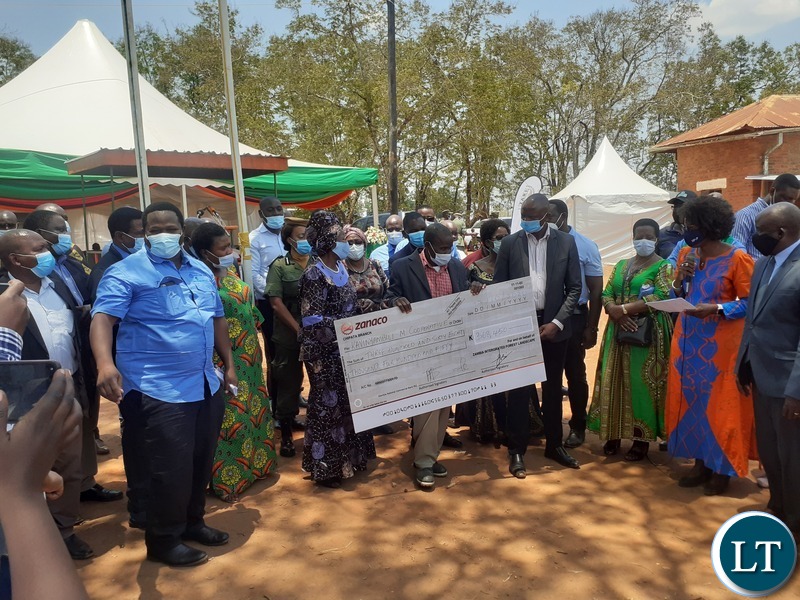 Vice-President Inonge Mutukwa Wina and Minister of National Development Planning Alexander Chiteme hand over Zambia Integrated Forest Landscape Projects grants cheques to Sinda Member of Parliament Masauso Phiri and some of his constituents in Chapata on 17 October 2020. PHOTO | MNDP 