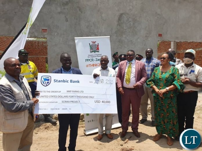Danies Chisenda hands over check worth USD 40, 000 grant in chibombo 29-10-20