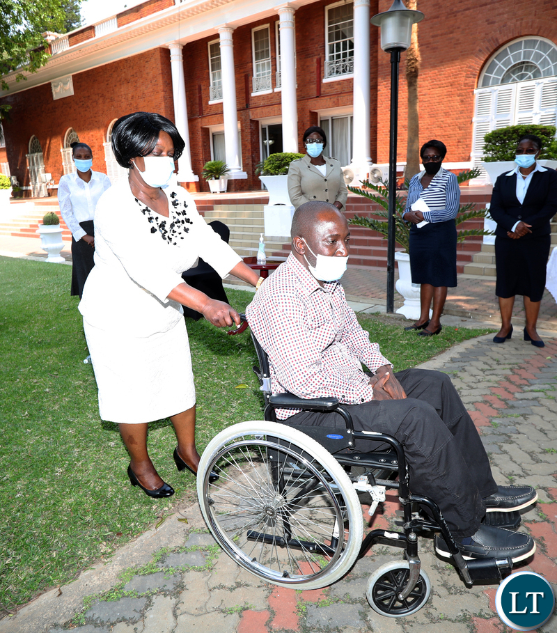First Lady Esther Lungu serves Mr Shadrick Kankwala at State House where she donated a wheelchair to him on Tuesday, October 6,2020- Pictures by Eddie Mwanaleza/State house 06-10-2020 