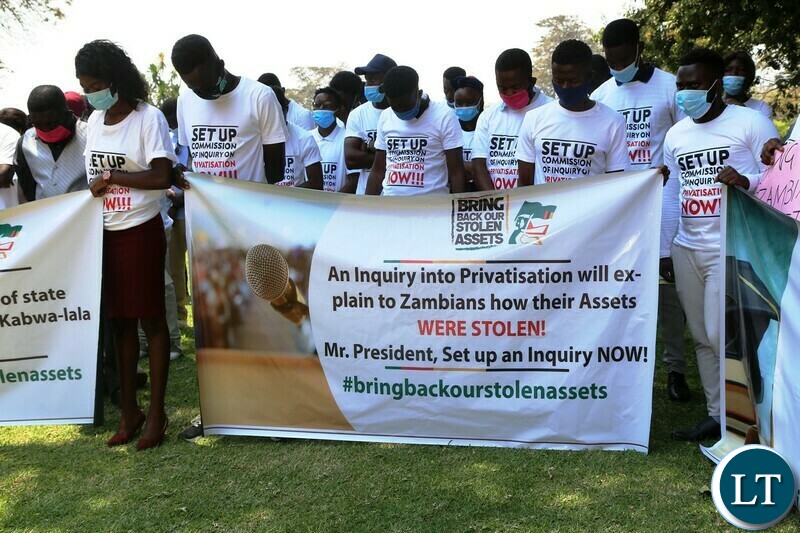 Protesting students displaying banners at State House when they presented a petition on the Privatisation of National assets