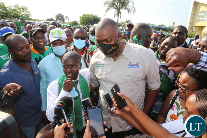 Patriotic Front Copperbelt Provincial Chairman MCC Nathan Chanda with Copperbelt Chairman Mobilization Bowman Lusambo embraces one another after a meeting with PF Secretary General Davis Mwila at Moba Hotel in Kitwe
