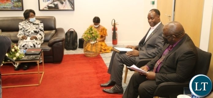 Vice President Inonge Wina confers Kitwe Posters followship leader Dr. Laddy Lewila during the meeting with clergy in Kitwe