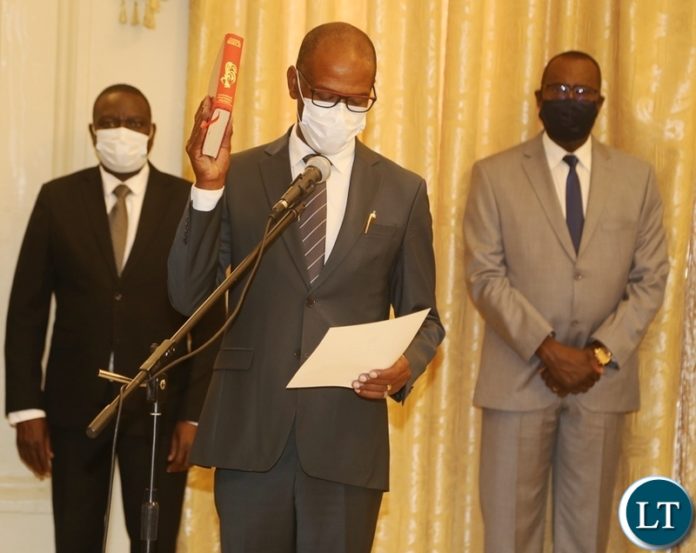 Newly appointed Bank of Zambia Governor Christopher Mvunga takes oath during the swearing ceremony at State House.