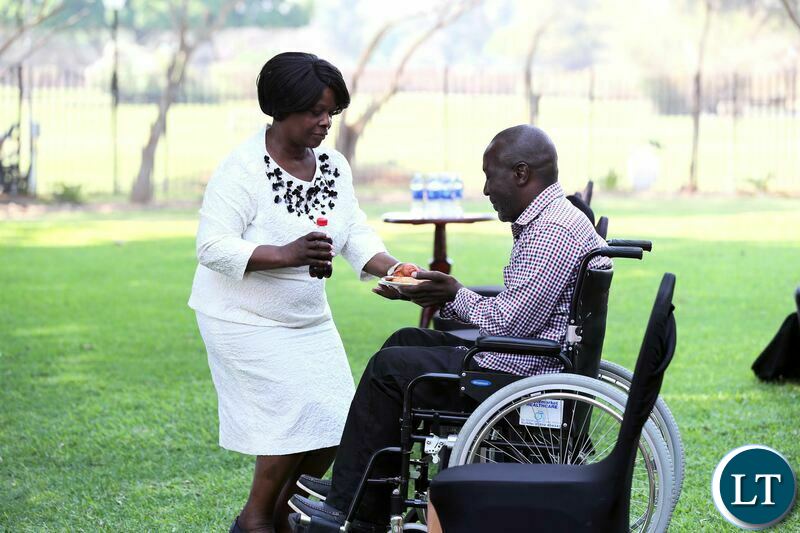 First Lady Esther Lungu serves Mr Shadrick Kankwala at State House where she donated a wheelchair to him on Tuesday, October 6,2020- Pictures by Eddie Mwanaleza/State house 06-10-2020 