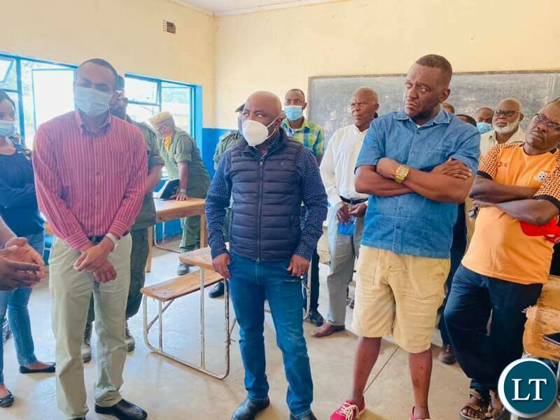 Home Affairs Minister Stephen Kampyongo and Mazabuka Central Member of Parliament Garry Nkombo inspecting NRCs issuance