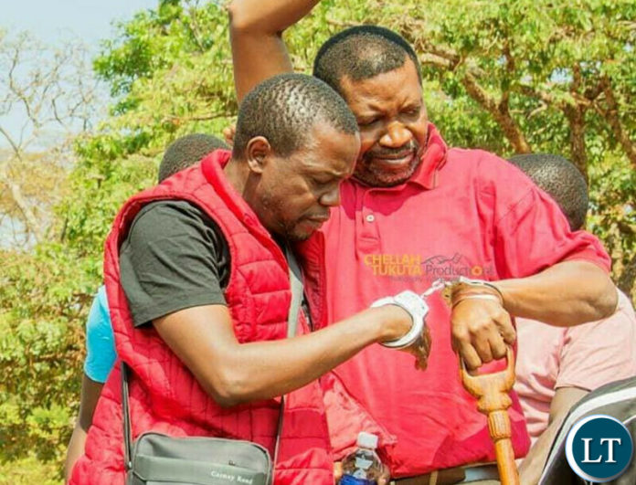 UPND Deputy Secretary General Patrick Mucheleka and three others arrive at the Kasama Magistrate Court from Milima state correctional facility