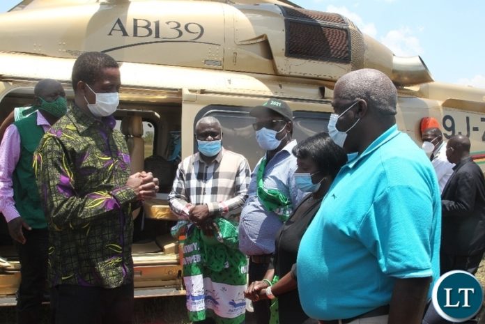 President Lungu confers with Northern Province Minister Bwalya Chungu when he arrived in Chilubi district to drum up support for PF council chairperson candidate in Thursday's by-election. President Lungu confers with Northern Province Minister Bwalya Chungu when he arrived in Chilubi district to drum up support for PF council chairperson candidate in Thursday's by-election.