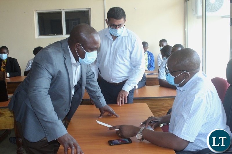 Ministry of Health Technical Services Permanent Secretary Dr. Kennedy Malama (r) shares notes with Lewanika General Hospital Medical Superintendent Dr. NjekwaSamutumwa (l) and his deputy Dr. SubhashSoni (c) before addressing health workers in Mongu