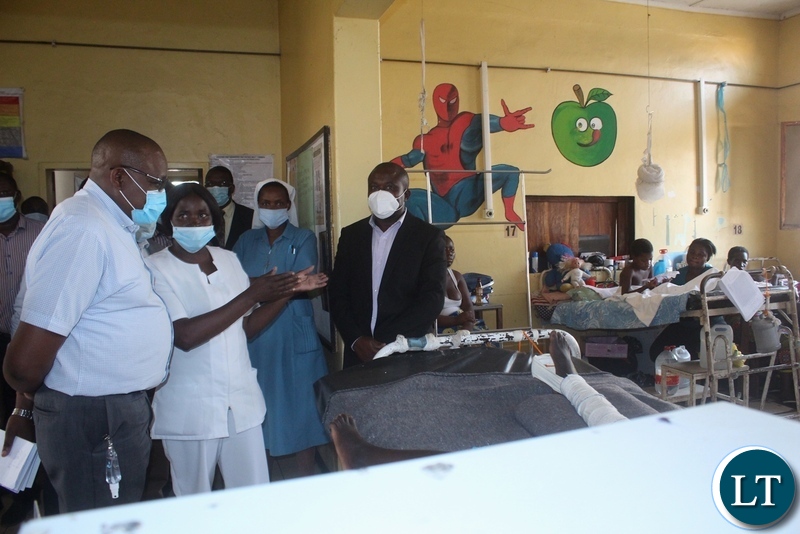 Lewanika General Hospital Children’s Ward nurse Nawa Monde (c) guiding Ministry of Health Technical Services Permanent Secretary Dr. Kennedy Malama (l) through the ward during visiting of health facilities in Mongu
