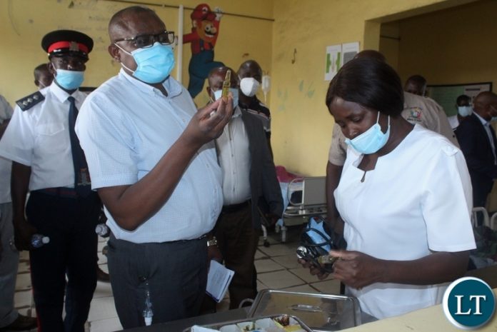 Ministry of Health Technical Services Permanent Secretary Dr. Kennedy Malama (l) checking the drugs on Lewanika General Hospital Children’s Ward nurse NawaMonde’s (r) tray during visiting of health facilities in Mongu Ministry of Health Technical Services Permanent Secretary Dr. Kennedy Malama (l) checking the drugs on Lewanika General Hospital Children’s Ward nurse NawaMonde’s (r) tray during visiting of health facilities in Mongu