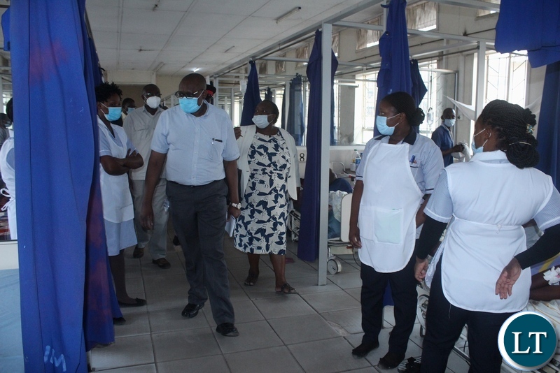 Ministry of Health Technical Services Permanent Secretary Dr. Kennedy Malama (c) touring Lewanika General Hospital wards during visiting of health facilities in Mongu