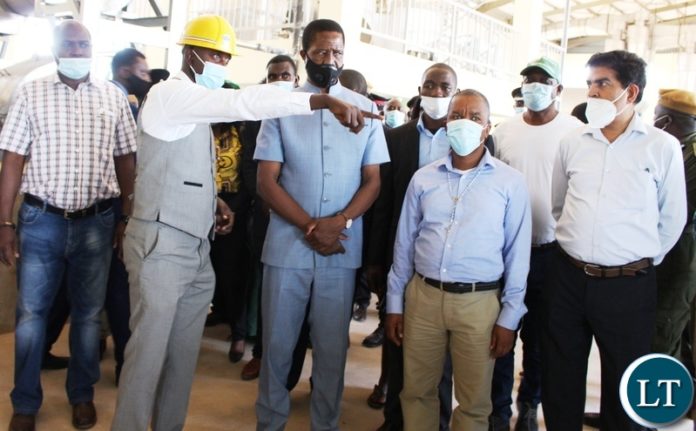 President Edgar Lungu listens to Chitambo District Agricultural Officer Katumwa Mutandi explains how the newly constructed Chitambo Cassava plant will be operating once commissioned. Picture by SUNDAY BWALYA /ZANIS