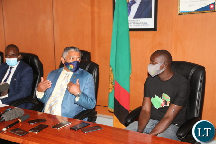 Minister of Justice Given Lubinda encouraging Martain Chomba Mambwa not to fight but be the man of peace during the media briefing at the Ministry of Justice yesterday. November 02, 2020. Picture by ROYD SIBAJENE/ZANIS
