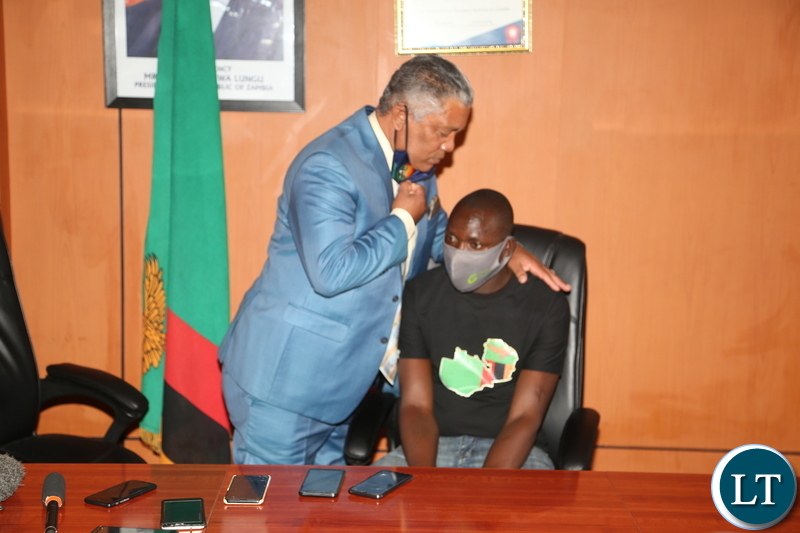  Minister of Justice Given Lubinda kiss of forgiveness to Martain Chomba Mambwa who assaulted the Minister and he was jailed but out of jail after the President Edgar Lungu pandoned him during the media briefing at the Ministry of Justice yesterday. November 02, 2020.  Picture by ROYD SIBAJENE/ZANIS